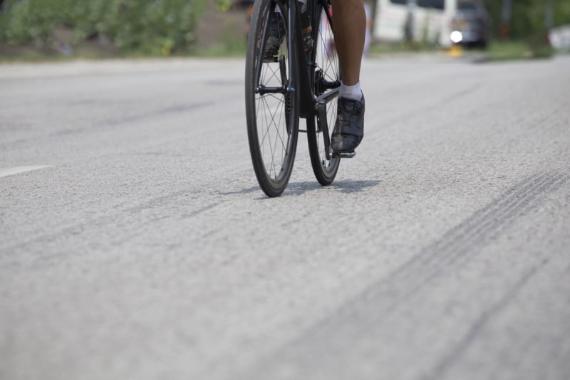 Cycling competition,rides a bike on asphalt road.