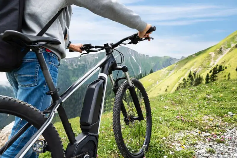 Main On Mountain With His Bike In Alps