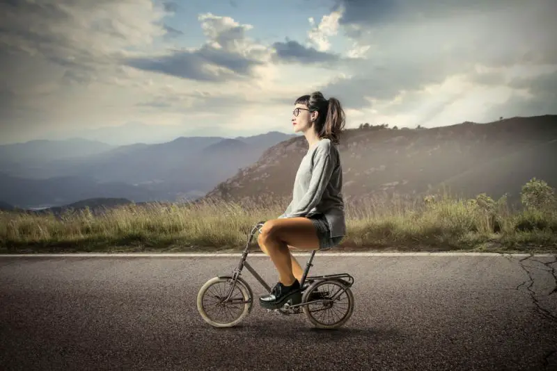 girl riding a small bike
